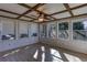 Sunroom featuring windows with an exterior view, ceiling fan, and wood floors at 510 Debra Dr, Marietta, GA 30066