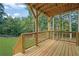 Wooden deck with railing overlooking green lush forest at 553 Somersby Dr, Dallas, GA 30157