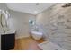 Bathroom featuring a freestanding tub, tiled walls, and a double sink vanity at 553 Somersby Dr, Dallas, GA 30157