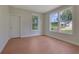 Comfortable room with hardwood floors, neutral walls, bright windows, and a closet at 553 Somersby Dr, Dallas, GA 30157