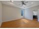 Spacious main bedroom with hardwood floors, ceiling fan, and ensuite bathroom at 553 Somersby Dr, Dallas, GA 30157