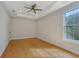 Bright main bedroom with a window and hardwood floors at 553 Somersby Dr, Dallas, GA 30157