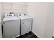 Functional laundry area featuring a washer and dryer for added convenience at 7714 Sudbury Cir, Covington, GA 30014