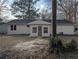 Backyard view of the home, showing the home's vinyl siding and a simple backyard space at 8168 Spring Ct, Riverdale, GA 30274