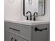 Bathroom vanity features white countertops and black hardware at 8168 Spring Ct, Riverdale, GA 30274