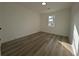 Bright bedroom with hardwood floors and ample natural light at 8168 Spring Ct, Riverdale, GA 30274