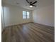 Bright bedroom with lots of space, wood floors, and natural light at 8168 Spring Ct, Riverdale, GA 30274