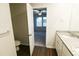 Bathroom with granite countertops, a single sink vanity, and a toilet visible at 8656 Webb Rd, Riverdale, GA 30274