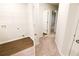 Hallway with wood-look flooring leading to a closet and other rooms at 8656 Webb Rd, Riverdale, GA 30274