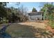 Spacious backyard with a patio and surrounding trees at 1976 Northside Nw Dr, Atlanta, GA 30318