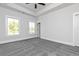 Bright bedroom with dual windows, soft gray carpet, and ample natural light at 316 Oak Arms Way, Woodstock, GA 30188
