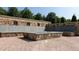 Inviting outdoor fire pit area featuring stone benches and brick paving, perfect for gatherings at 316 Oak Arms Way, Woodstock, GA 30188