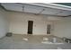 Spacious garage with ample room for parking and storage, featuring bright lighting at 316 Oak Arms Way, Woodstock, GA 30188