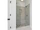 Modern glass shower with a tiled surround and a built-in bench at 316 Oak Arms Way, Woodstock, GA 30188