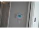 Smart home system mounted on the wall near a door for easy control of home functions at 316 Oak Arms Way, Woodstock, GA 30188