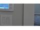 Close-up of a smart home system control panel and light switch on a wall at 316 Oak Arms Way, Woodstock, GA 30188