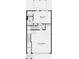 Floorplan showing layout of garage, foyer, 1 bedroom with walk-in closet and full bath on the first level at 6228 Kenbrook Dr, Tucker, GA 30084