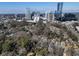 Sweeping aerial view of a neighborhood nestled near a vibrant city skyline, offering a unique urban-suburban lifestyle at 787 Martina Ne Dr, Atlanta, GA 30305