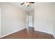 This bedroom has dark wood laminate flooring and a doorway leading to another room at 848 Capitol View Nw Ave, Atlanta, GA 30318
