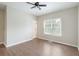 This bedroom has laminate flooring, a ceiling fan, and a bright window at 848 Capitol View Nw Ave, Atlanta, GA 30318
