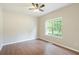 Serene bedroom featuring wood-look flooring, a ceiling fan, and plenty of natural light for a tranquil retreat at 848 Capitol View Nw Ave, Atlanta, GA 30318