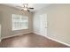 This bedroom has laminate flooring and a bright window with backyard view at 848 Capitol View Nw Ave, Atlanta, GA 30318