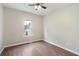 This bedroom includes dark wood laminate flooring and a large window at 848 Capitol View Nw Ave, Atlanta, GA 30318