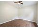 This bedroom features dark wood laminate flooring, a ceiling fan, and neutral paint at 848 Capitol View Nw Ave, Atlanta, GA 30318