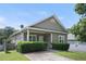 Attractive home with a well-kept lawn, simple landscaping, and a cozy covered porch at 848 Capitol View Nw Ave, Atlanta, GA 30318