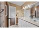 Bathroom featuring dual sinks, granite counters, tile floors, and ample lighting at 10846 Sunfield Way, Hampton, GA 30228