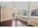 A dining area features hardwood floors, natural light, and an opening to the kitchen at 10846 Sunfield Way, Hampton, GA 30228