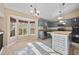 A well-lit kitchen features an island, stainless steel appliances, and a breakfast nook at 10846 Sunfield Way, Hampton, GA 30228