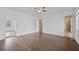 Spacious main bedroom featuring hardwood floors with a walk-in closet and attached bath at 10846 Sunfield Way, Hampton, GA 30228