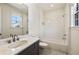 Well-lit bathroom featuring subway tile shower/tub and a vanity with white countertop and bronze faucet at 116 Lily Garden Pl # 12, Alpharetta, GA 30009