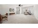 Spacious bonus room featuring neutral carpet, ceiling fan, and natural light from multiple windows at 2434 Soft Maple St, Atlanta, GA 30360