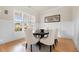 Bright dining room featuring wainscoting, a round table, and large windows that offer ample natural light at 2434 Soft Maple St, Atlanta, GA 30360