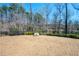 Neighborhood dog park surrounded by tall trees, benches, and a water fountain at 2434 Soft Maple St, Atlanta, GA 30360