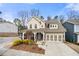 Charming two-story home featuring a welcoming front porch and well-manicured landscaping at 2434 Soft Maple St, Atlanta, GA 30360