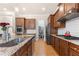 Gourmet kitchen with stainless steel appliances, granite counters, an island, and a subway tile backsplash at 2434 Soft Maple St, Atlanta, GA 30360