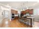 Kitchen features stainless steel appliances, granite counters, island with seating, and wooden cabinets at 2434 Soft Maple St, Atlanta, GA 30360