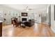 Bright living room with hardwood floors, a fireplace, a ceiling fan, and a comfortable leather couch at 2434 Soft Maple St, Atlanta, GA 30360