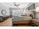 Serene main bedroom with hardwood floors, a ceiling fan, and decor at 2434 Soft Maple St, Atlanta, GA 30360