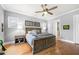 Serene main bedroom with hardwood floors, a ceiling fan, and decor at 2434 Soft Maple St, Atlanta, GA 30360