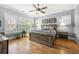 Serene main bedroom with hardwood floors, a ceiling fan, and decor at 2434 Soft Maple St, Atlanta, GA 30360