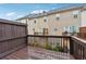 View of the backyard deck overlooking adjacent townhome units at 5392 Fox Creek Ln, Norcross, GA 30071
