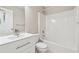 Well-lit bathroom with white vanity, toilet, and shower-tub combination at 5392 Fox Creek Ln, Norcross, GA 30071
