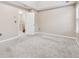 Neutral bedroom featuring a large closet, ensuite, and modern lighting at 5392 Fox Creek Ln, Norcross, GA 30071