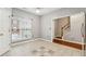 Bright dining area featuring tiled floors and a window letting in plenty of natural light at 5392 Fox Creek Ln, Norcross, GA 30071