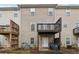 Exterior view showcasing townhouse units with individual decks and patios at 5392 Fox Creek Ln, Norcross, GA 30071