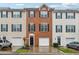 Charming townhome with a brick facade, complemented by a one-car garage and well-manicured landscaping at 5392 Fox Creek Ln, Norcross, GA 30071